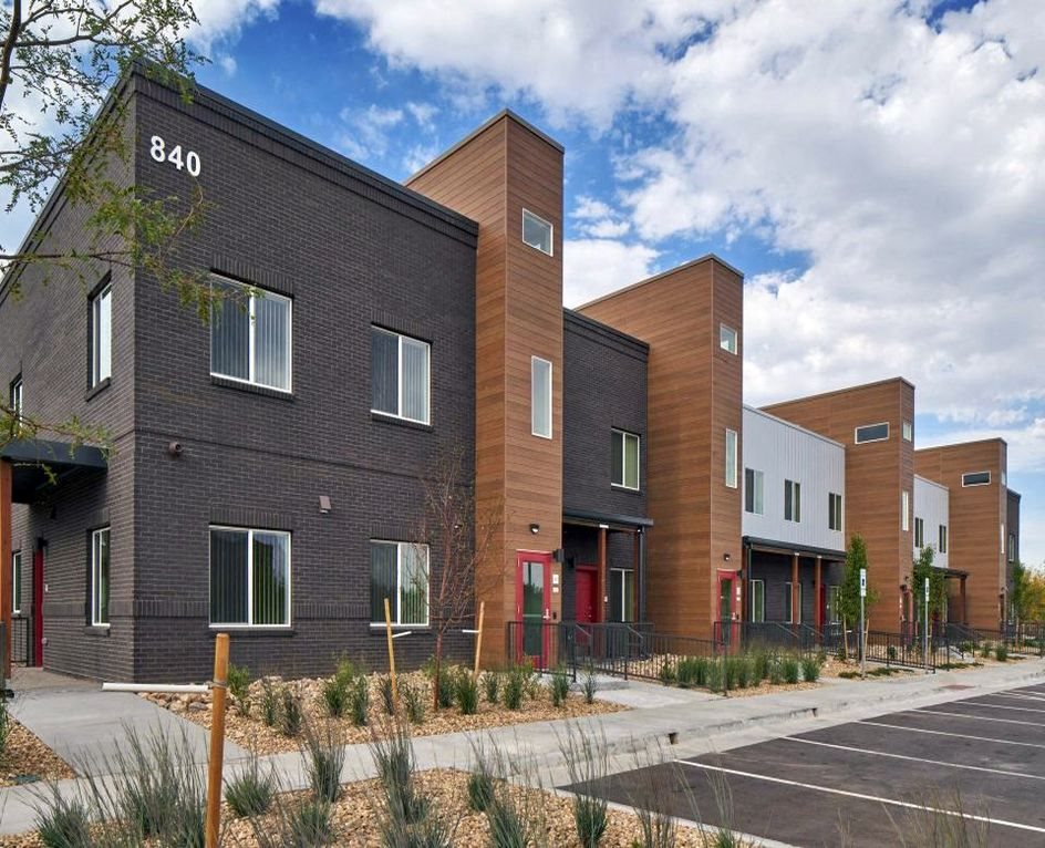 A picture showing D Building and part of the parking lot.